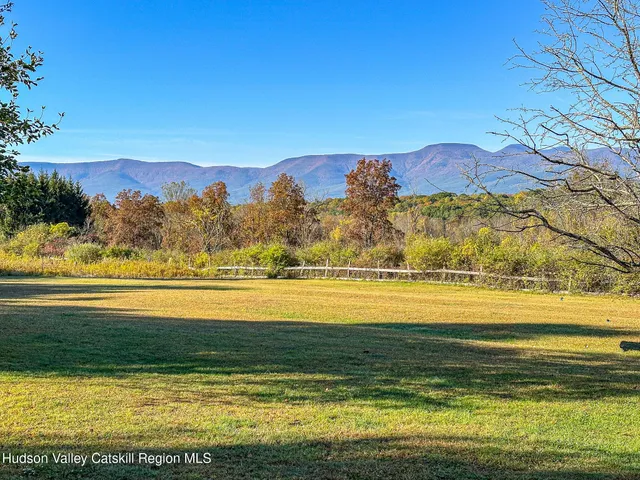 a view of an ocean and a mountain
