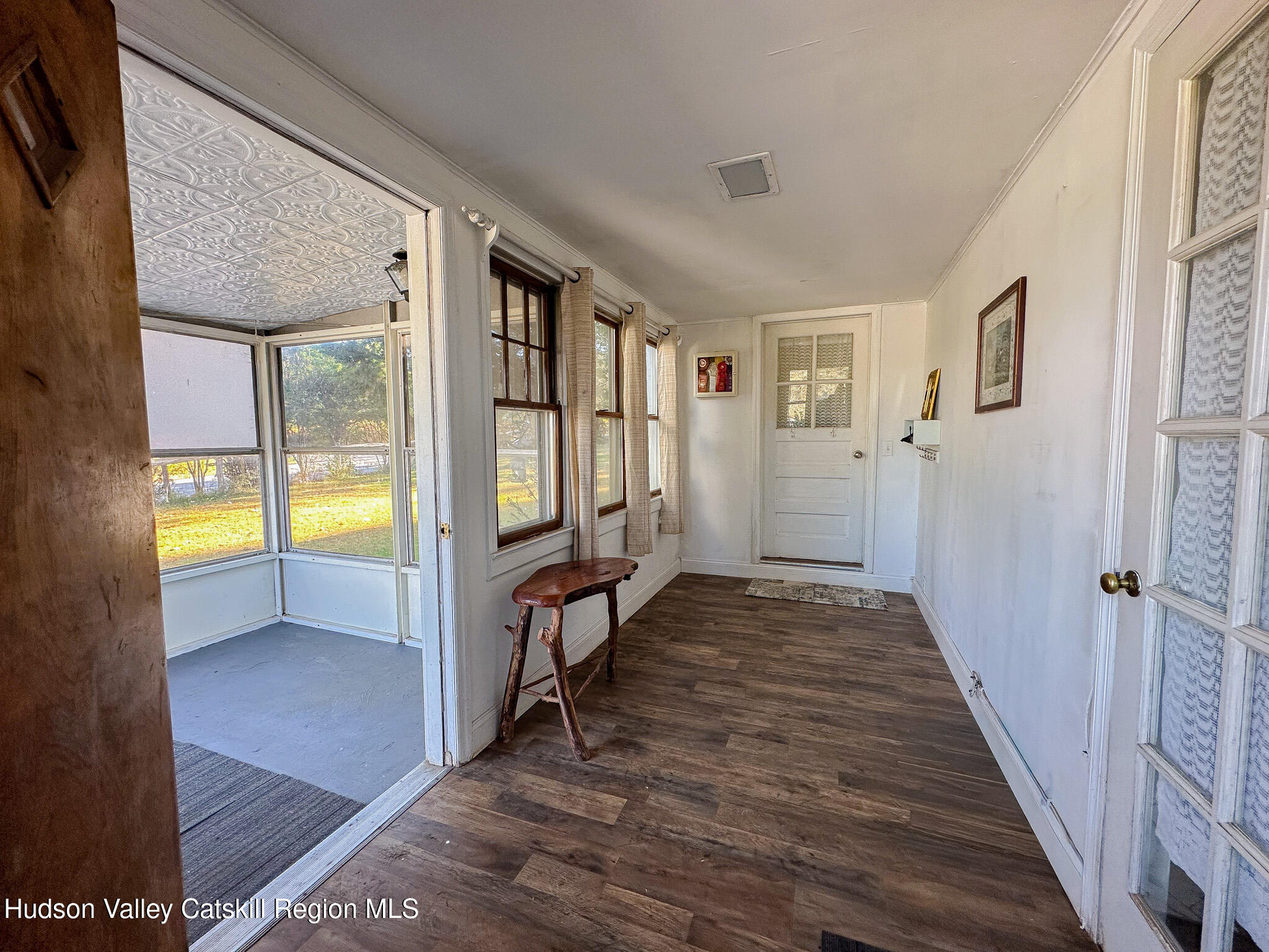 91 Drake Hill Road Greenville, NY 12431 - Photo 6 of 28 a view of a hallway with wooden floor and a livingroom