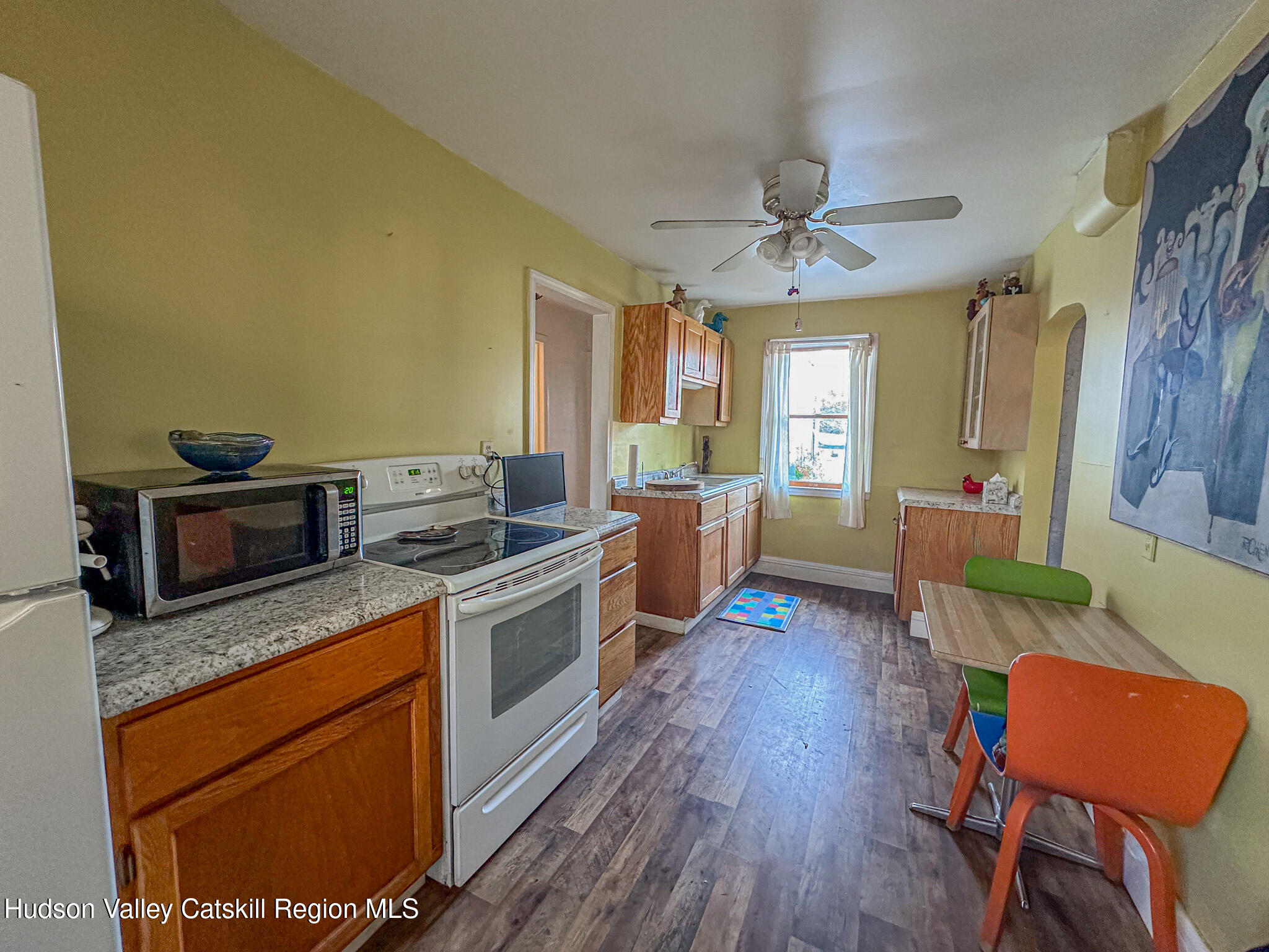 91 Drake Hill Road Greenville, NY 12431 - Photo 10 of 28 a kitchen with stainless steel appliances granite countertop a stove a sink dishwasher and a refrigerator with wooden floor