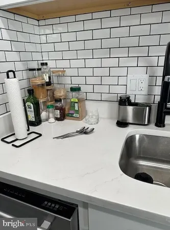 a kitchen with a sink and a stove