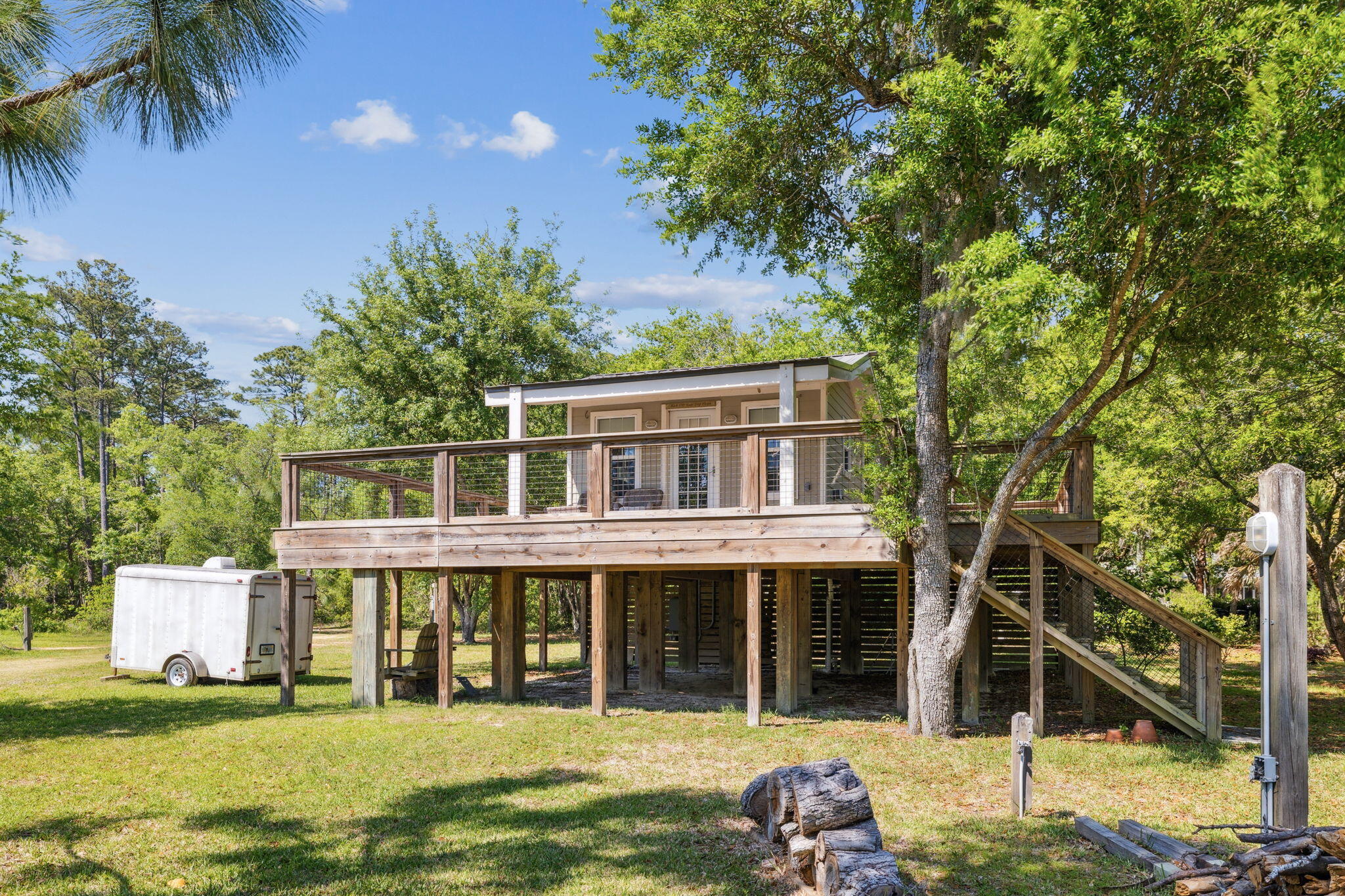 233 Shady Lane Freeport, FL 32439 - Photo 4 of 10 a house view with a garden space