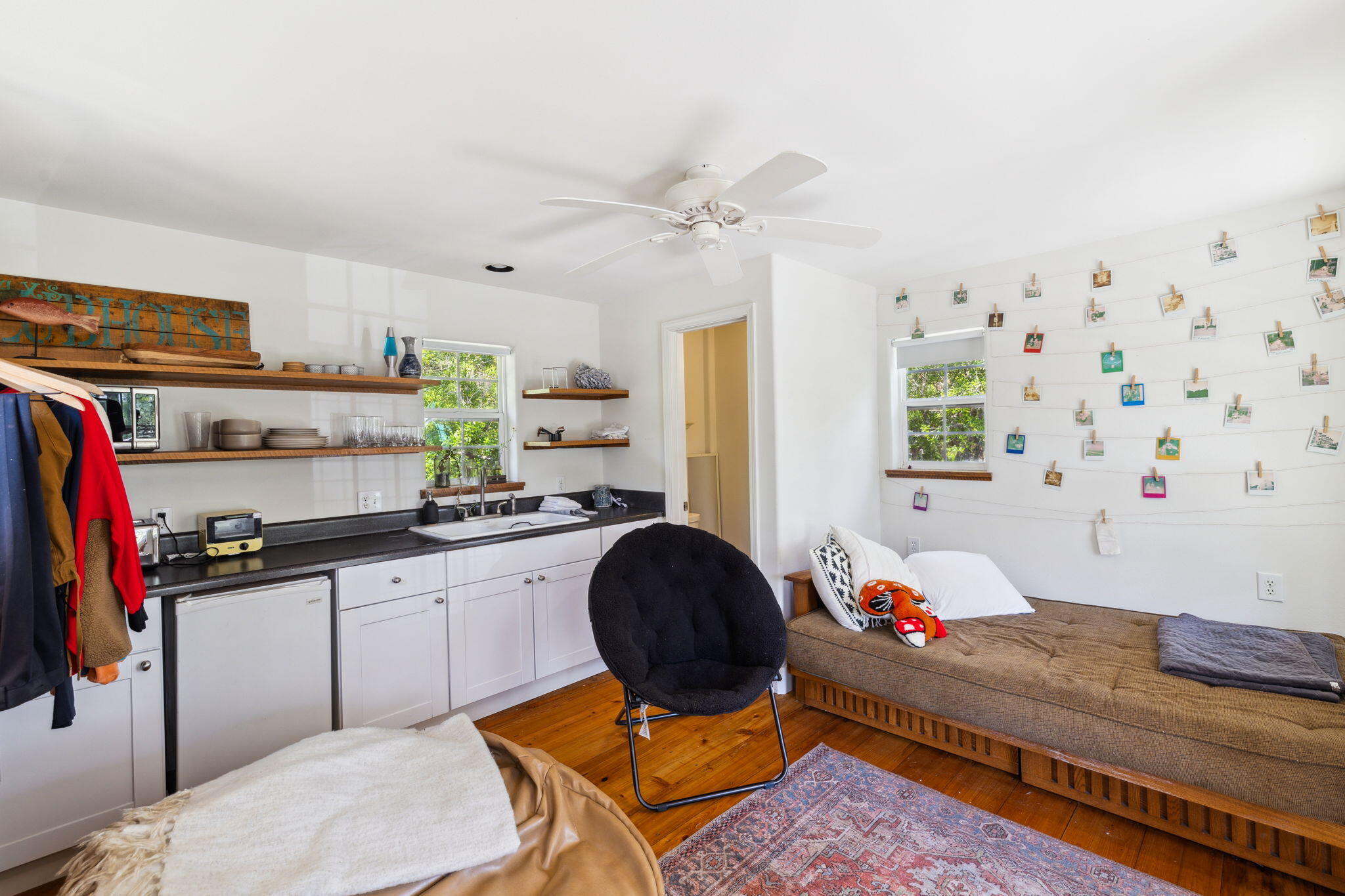 233 Shady Lane Freeport, FL 32439 - Photo 6 of 10 a kitchen with granite countertop a sink a stove a dining table and chairs