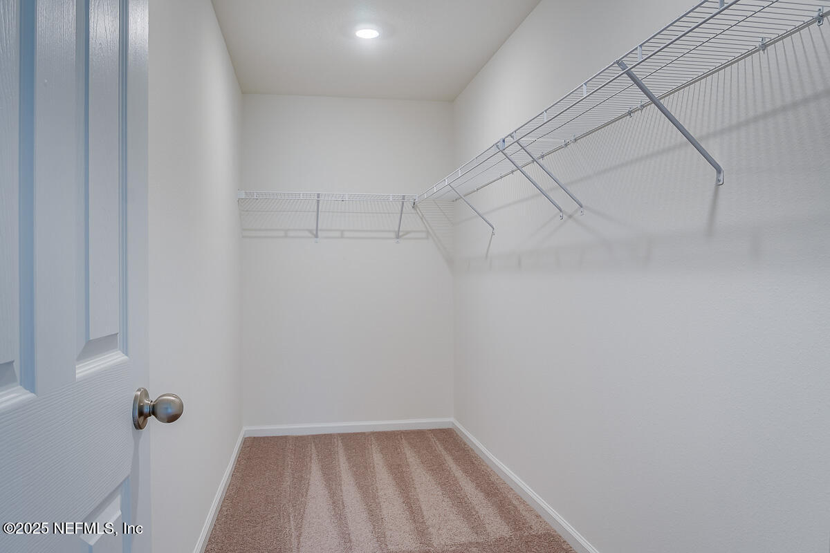 66 Stonecrest Drive St. Johns, FL 32259 - Photo 14 of 22 a view of a room with racks on the wall