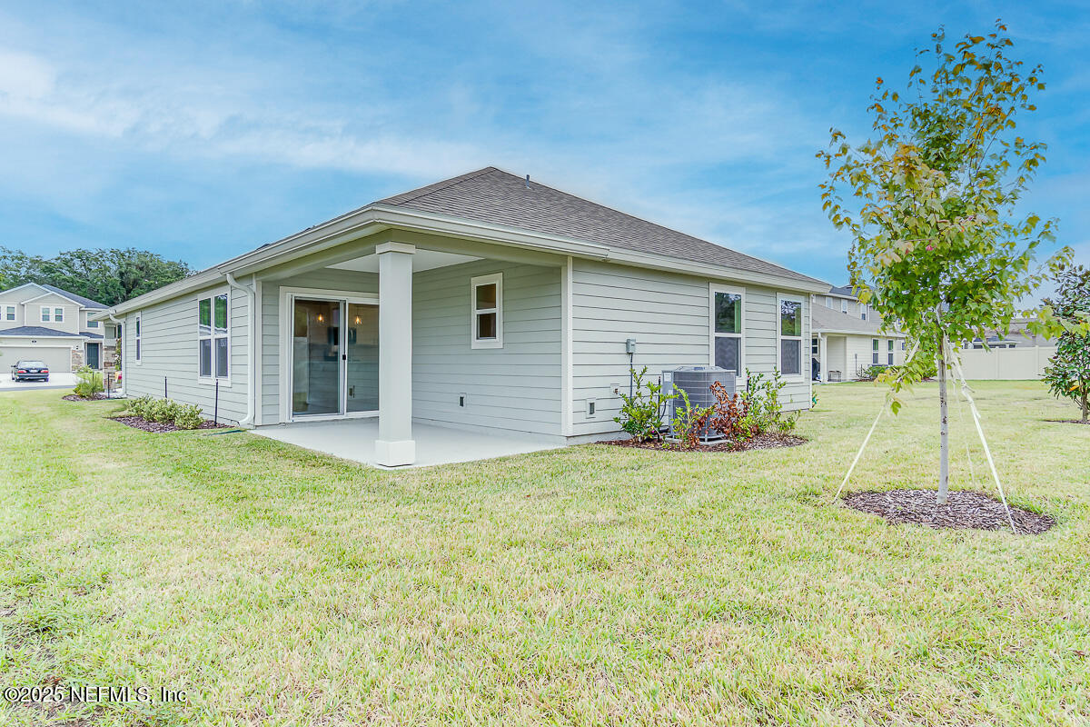 66 Stonecrest Drive St. Johns, FL 32259 - Photo 22 of 22 a front view of house with yard and green space
