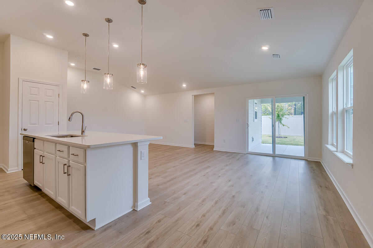 66 Stonecrest Drive St. Johns, FL 32259 - Photo 5 of 22 a view of a kitchen sink and a window wooden floor