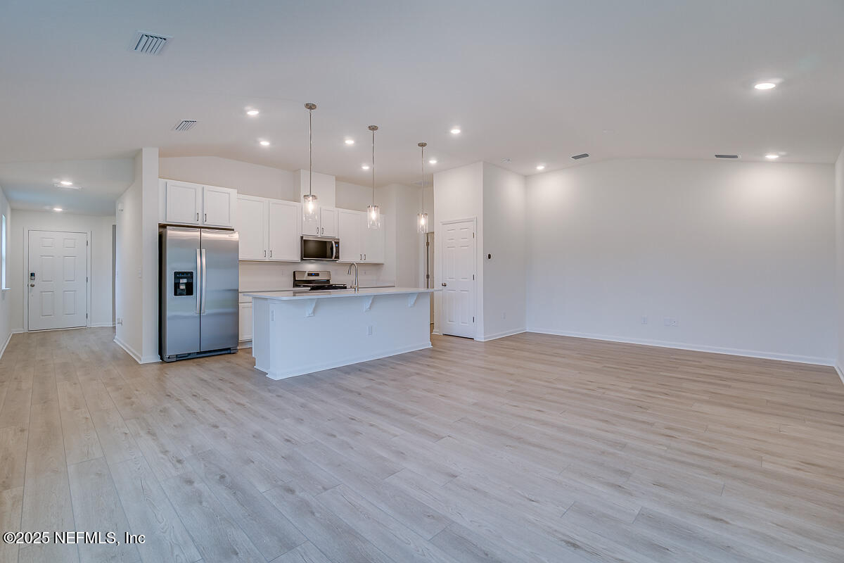 66 Stonecrest Drive St. Johns, FL 32259 - Photo 10 of 22 a view of a kitchen with a sink and a refrigerator