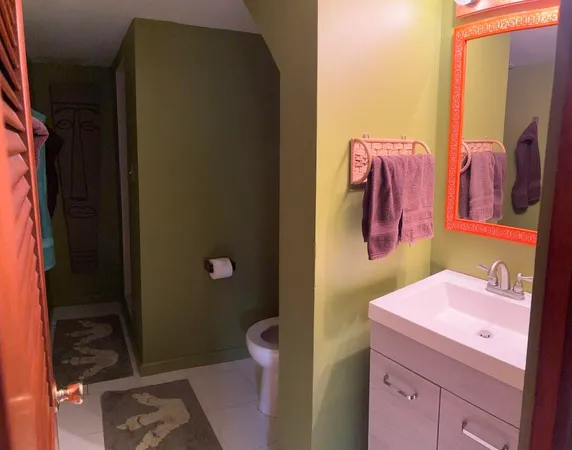 a bedroom with a bed and cabinets