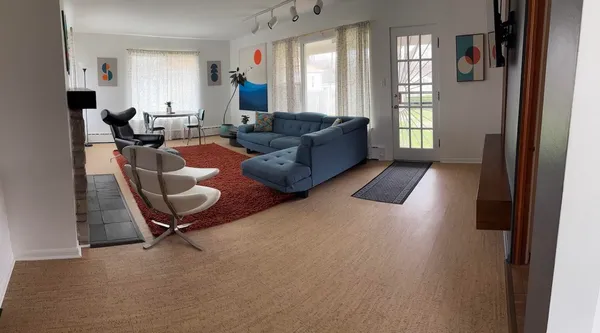 a living room with furniture rug and window