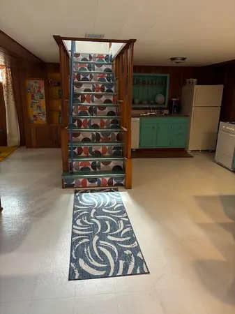 a kitchen with stainless steel appliances kitchen island a large island in the center