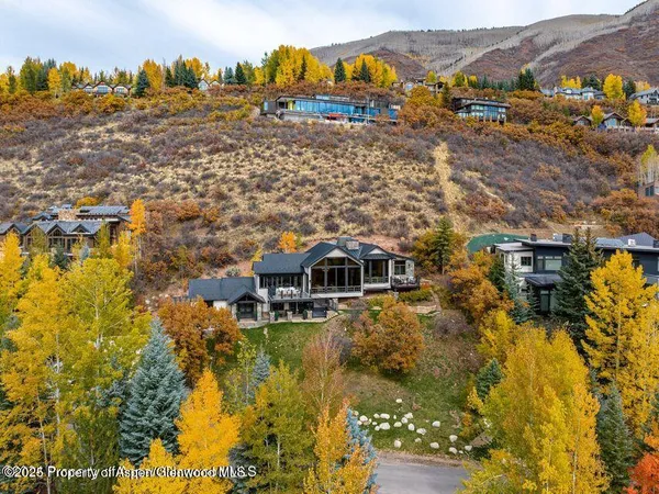 a aerial view of residential houses with outdoor space