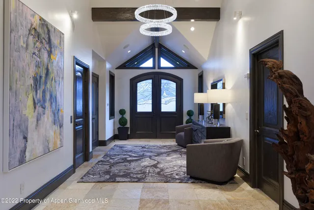 a living room with furniture and a rug