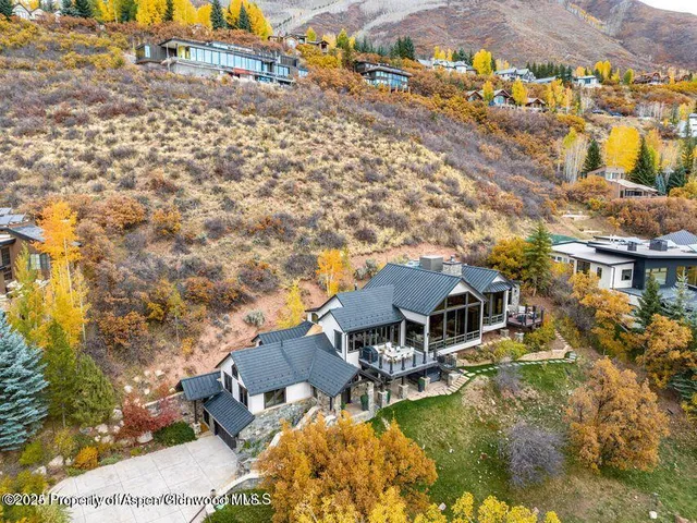 an aerial view of a house with swimming pool