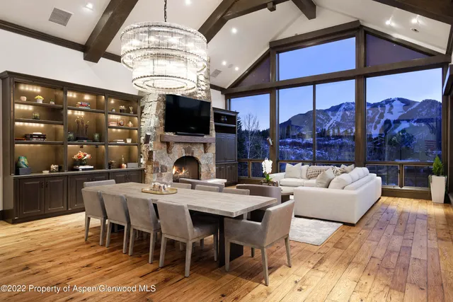 a living room with fireplace furniture and a flat screen tv