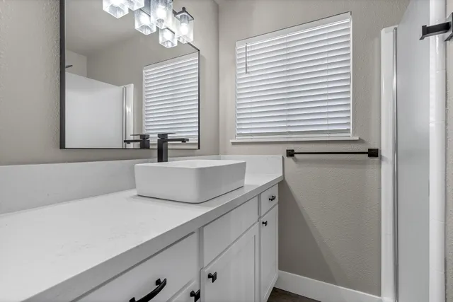 a bathroom with a sink and a mirror
