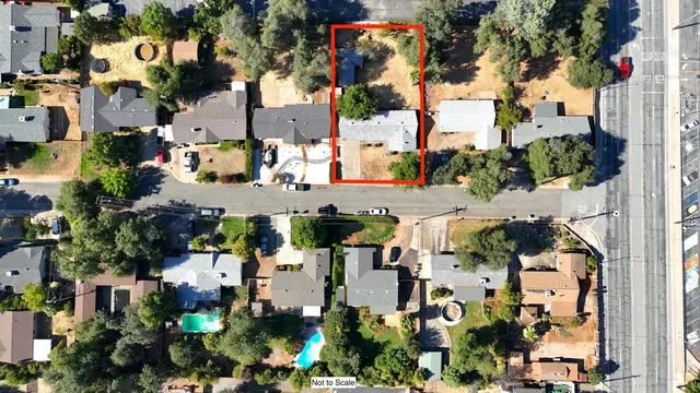 an aerial view of a house with a yard