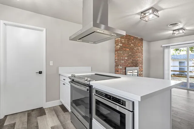 a kitchen with a stove and a microwave