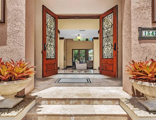 a kitchen with stainless steel appliances granite countertop a refrigerator and a stove