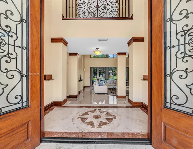 a kitchen with stainless steel appliances granite countertop a sink dishwasher and microwave oven with cabinets