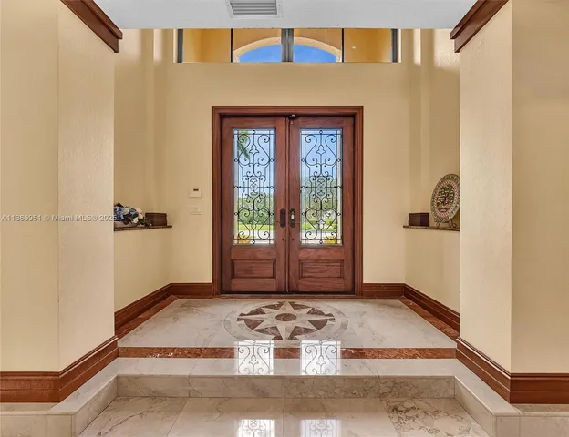a kitchen with a refrigerator and a stove