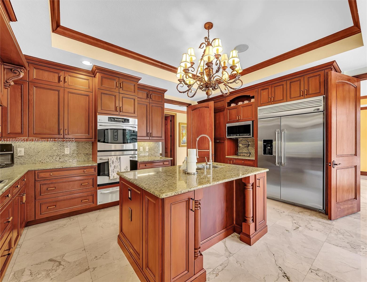 13425 Southwest 37th Place Davie, FL 33330 - Photo 24 of 100 a kitchen with stainless steel appliances granite countertop a sink refrigerator and cabinets