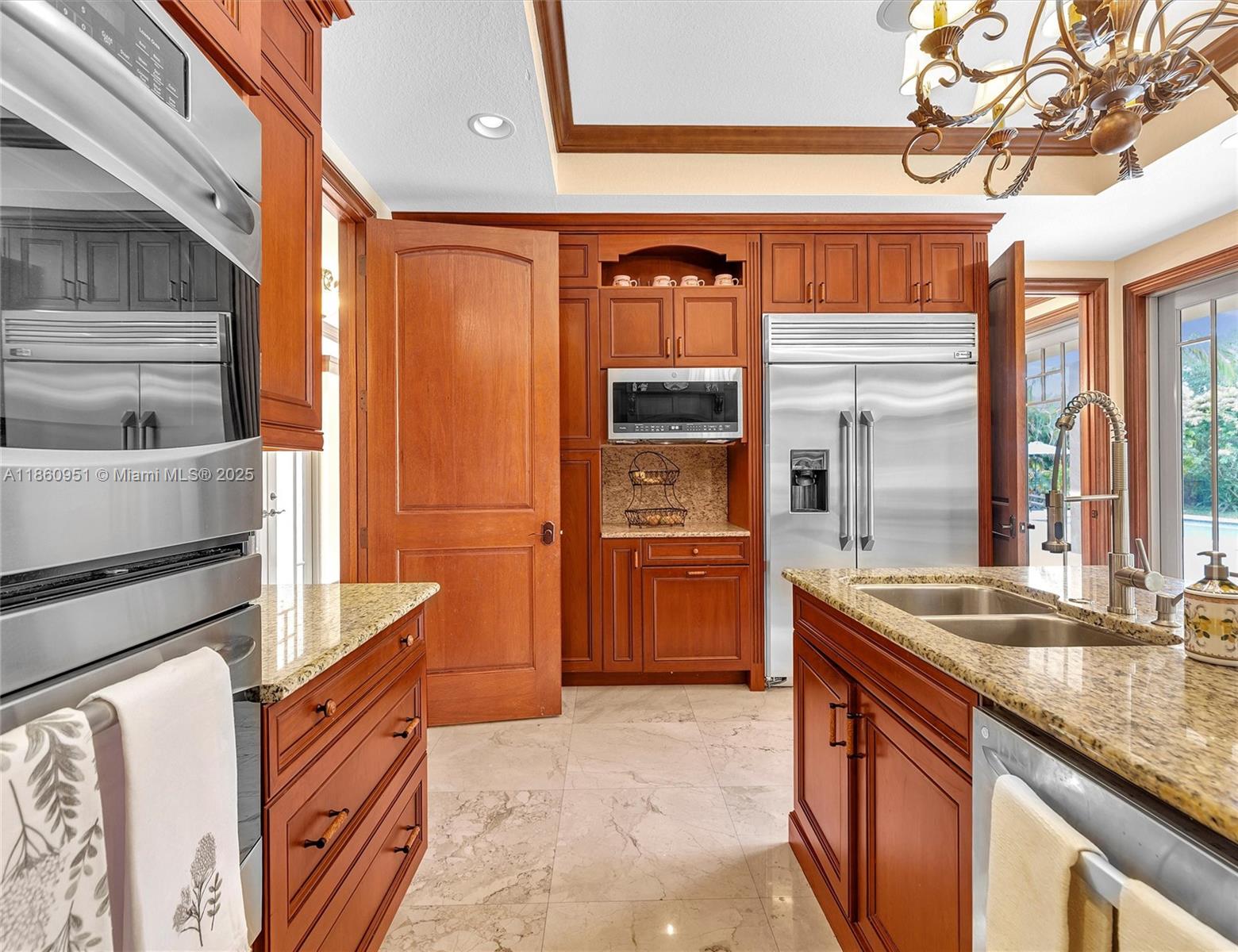 13425 Southwest 37th Place Davie, FL 33330 - Photo 28 of 100 a kitchen with stainless steel appliances granite countertop a refrigerator and a stove