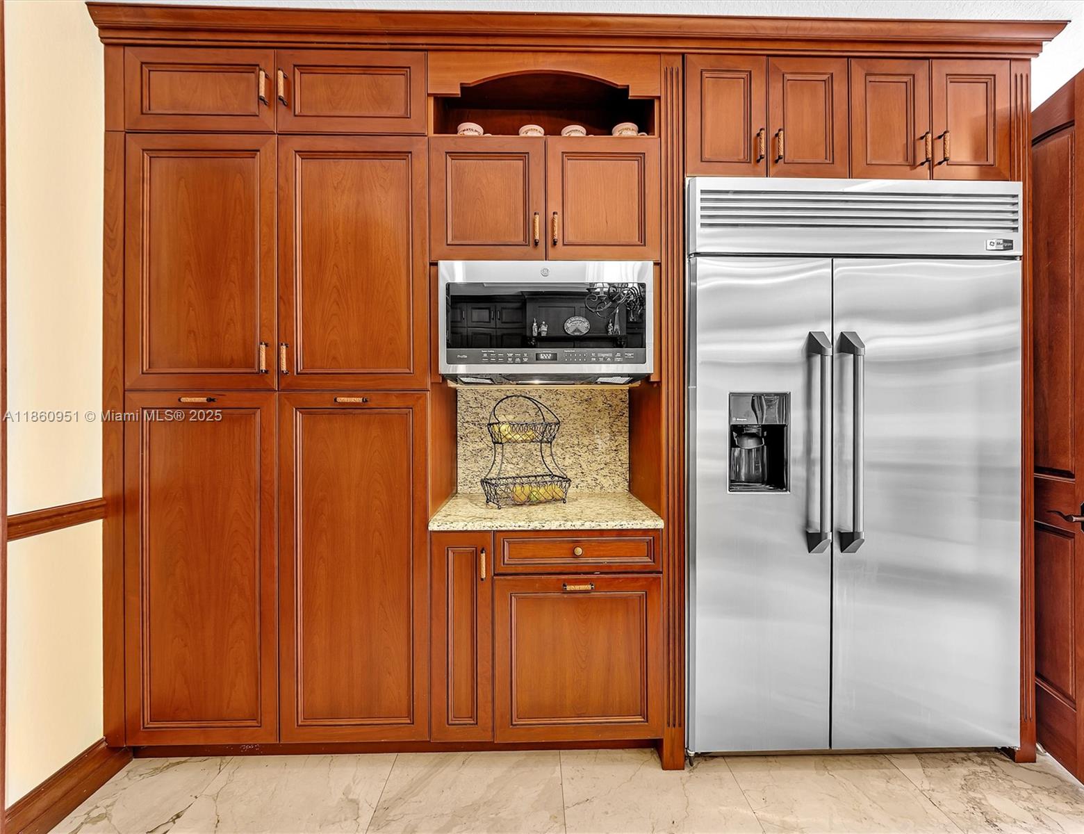 13425 Southwest 37th Place Davie, FL 33330 - Photo 31 of 100 a kitchen with a refrigerator and cabinets