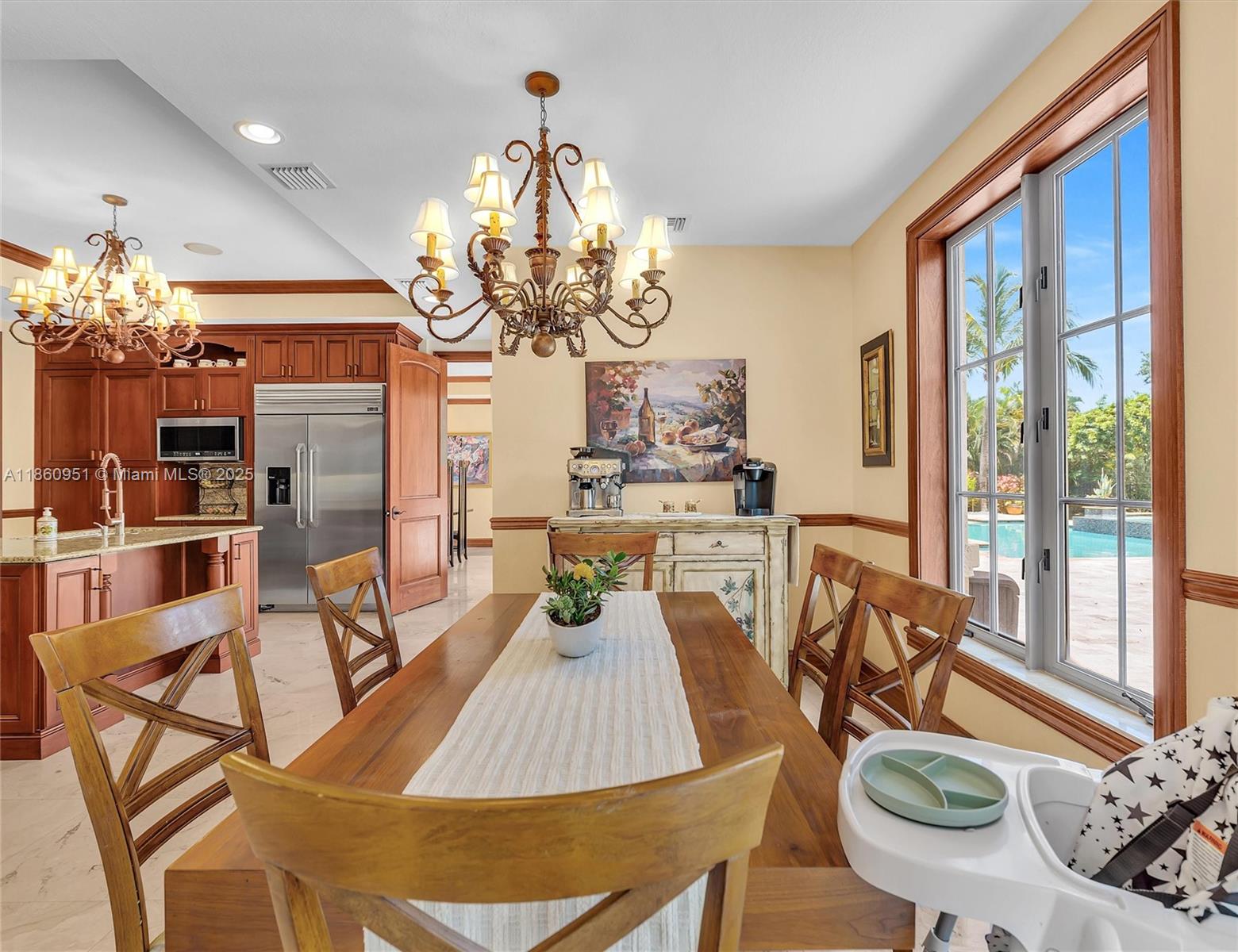 13425 Southwest 37th Place Davie, FL 33330 - Photo 36 of 100 a view of a dining room with furniture a chandelier and large windows
