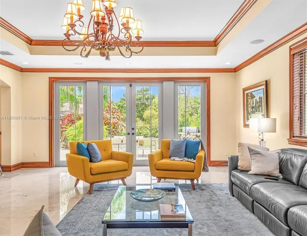 a view of a dining space with a table and chairs