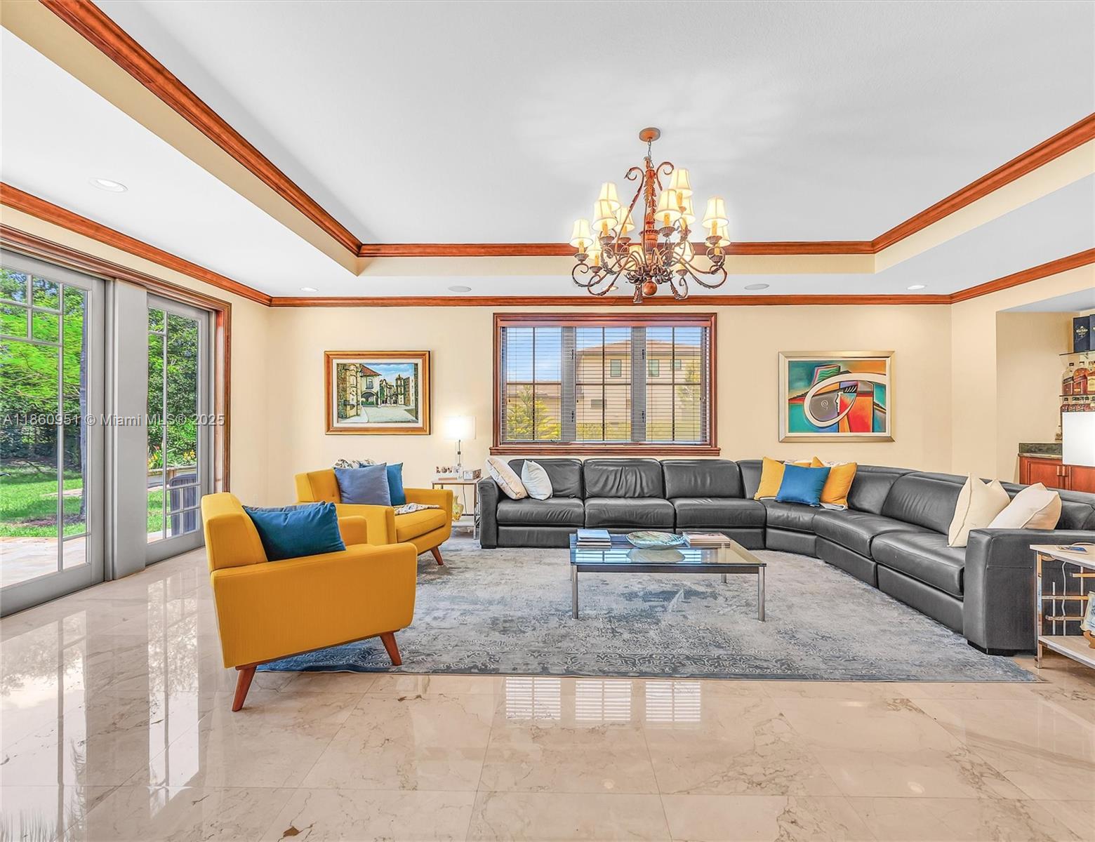 13425 Southwest 37th Place Davie, FL 33330 - Photo 48 of 100 a living room with furniture and a chandelier