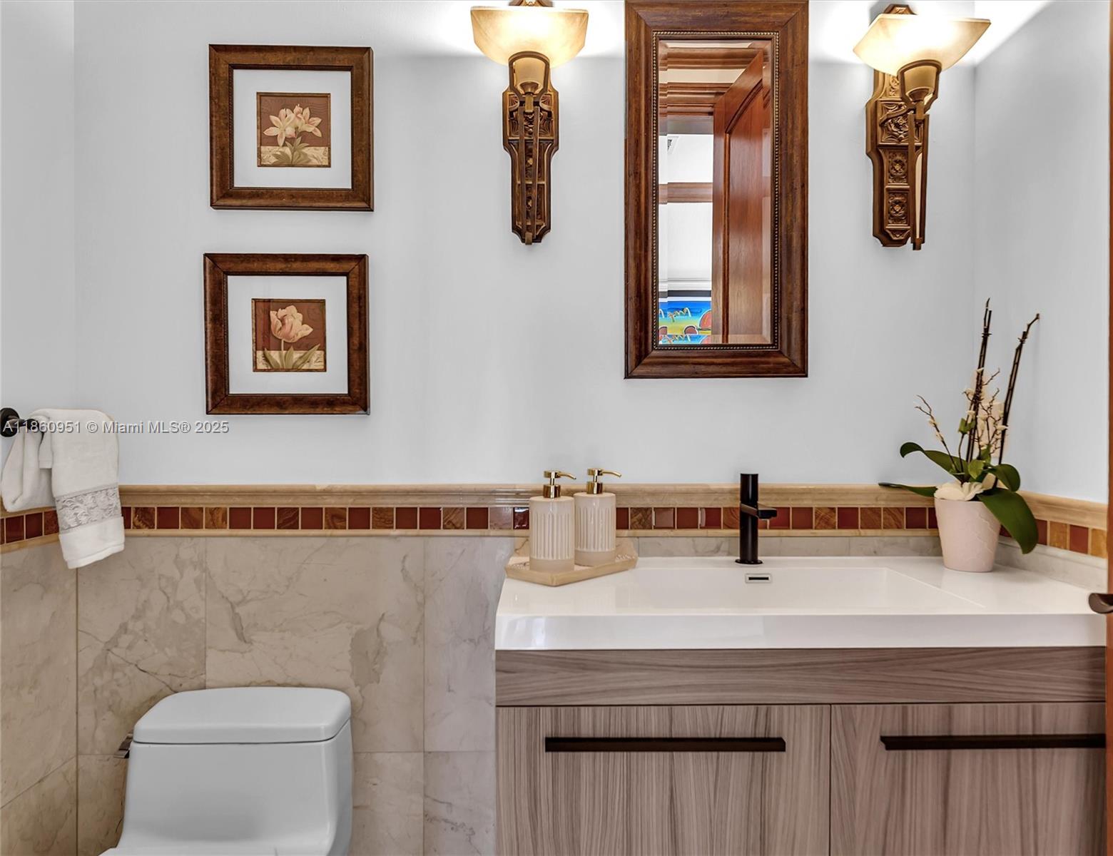 13425 Southwest 37th Place Davie, FL 33330 - Photo 52 of 100 a bathroom with a toilet a sink and mirror