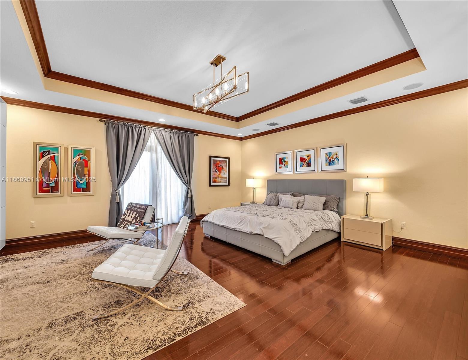 13425 Southwest 37th Place Davie, FL 33330 - Photo 76 of 100 a bedroom with a bed chandelier and a window