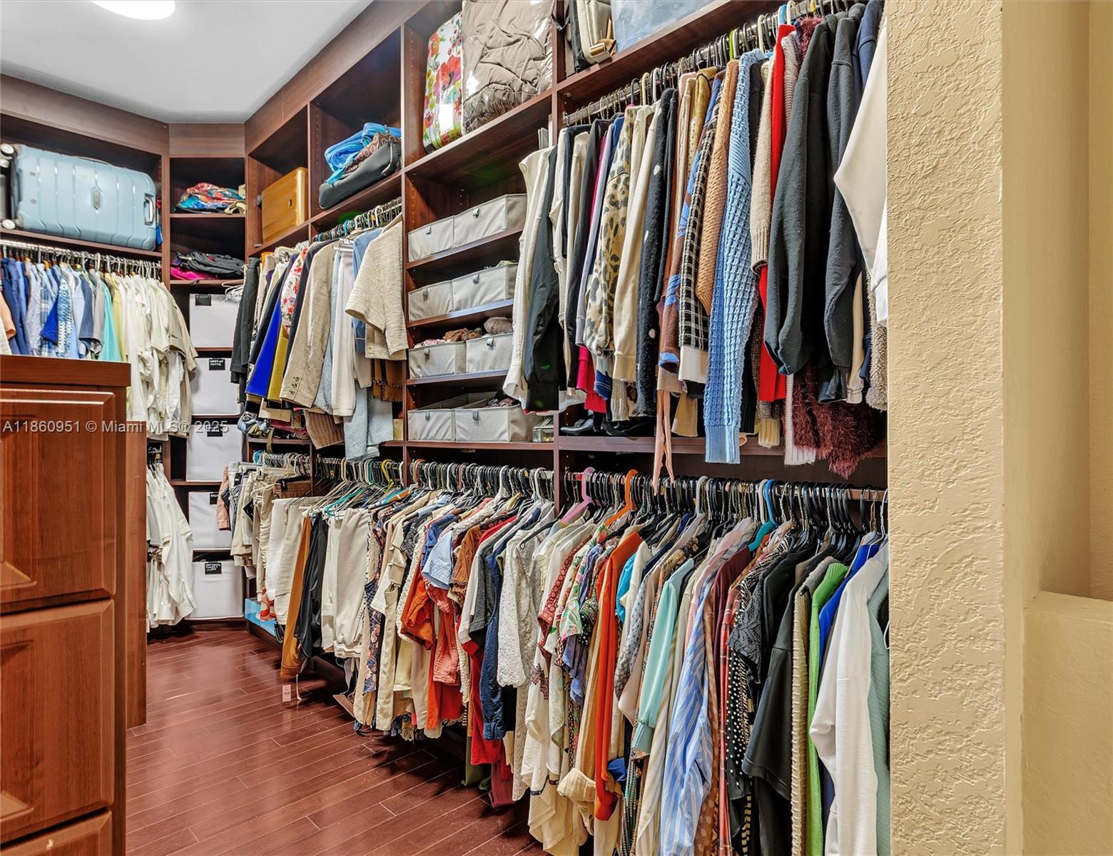 13425 Southwest 37th Place Davie, FL 33330 - Photo 79 of 100 a view of walk in closet with clothes and shoes