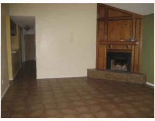 4242 Snowmass Street Corpus Christi, TX 78413 - Photo 2 of 7 a living room with a fireplace