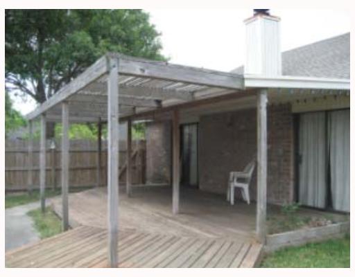 4242 Snowmass Street Corpus Christi, TX 78413 - Photo 3 of 7 a patio with table and chairs