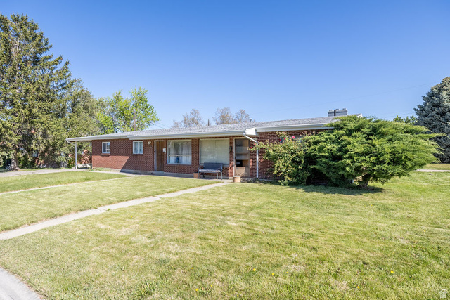 148 West Wicker Lane Bountiful, UT 84010 - Photo 3 of 27 Single story home with a porch, brick siding, and a front lawn