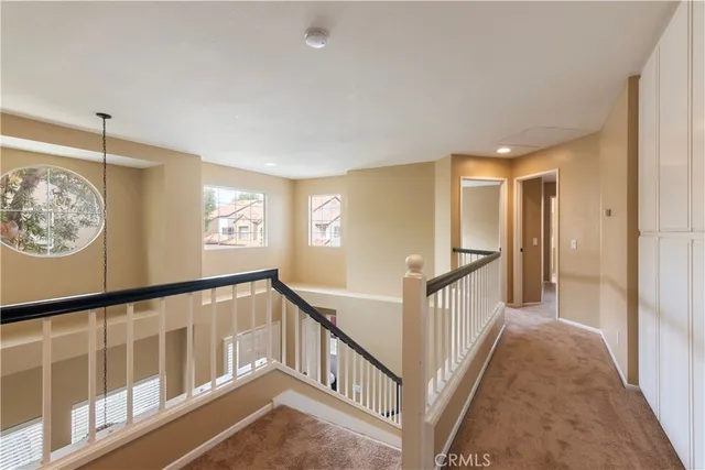a view of a hallway with windows