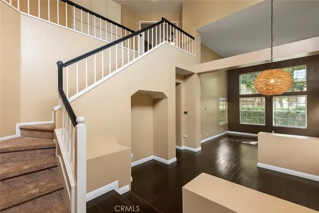 a view of an entryway with wooden floor