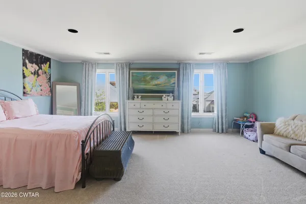 a bedroom with a bed and a couch