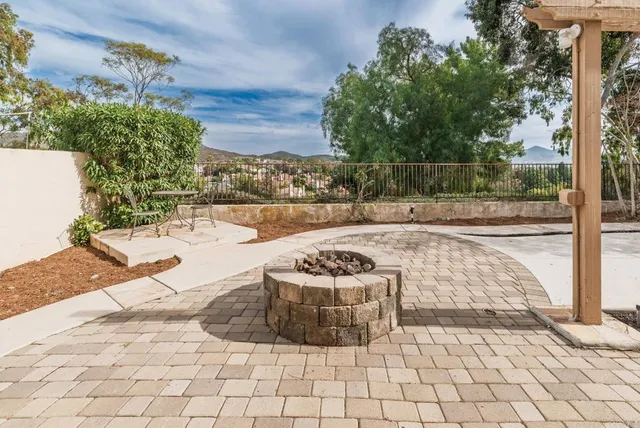 a view of a backyard and table