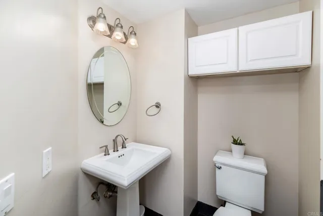 a kitchen with stainless steel appliances granite countertop a refrigerator a stove top oven a sink and dishwasher