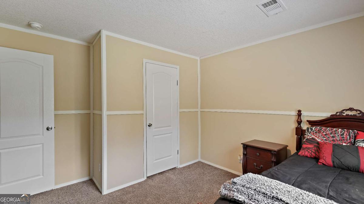 64 Sierra Road Jesup, GA 31545 - Photo 13 of 22 a living room with furniture and a window