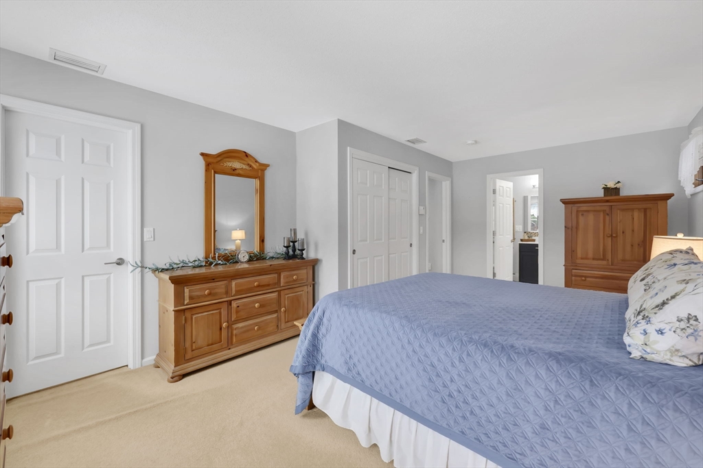 14 Bridle Path Broad Brook, CT 06016 - Photo 20 of 37 a bedroom with a bed and a dresser