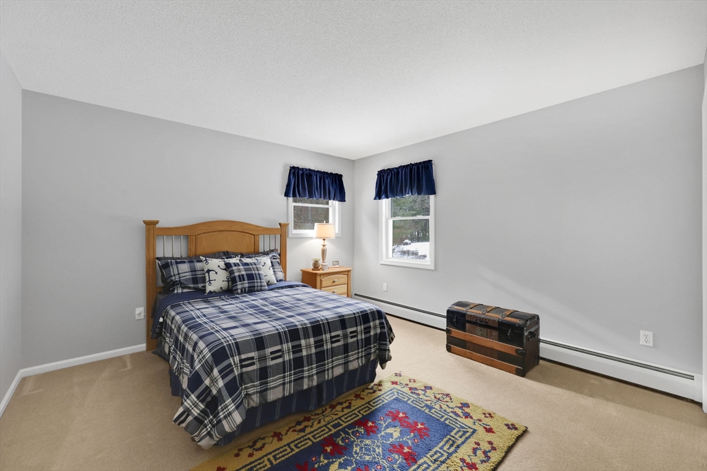 14 Bridle Path Broad Brook, CT 06016 - Photo 24 of 37 a bedroom with a bed a dresser and a window