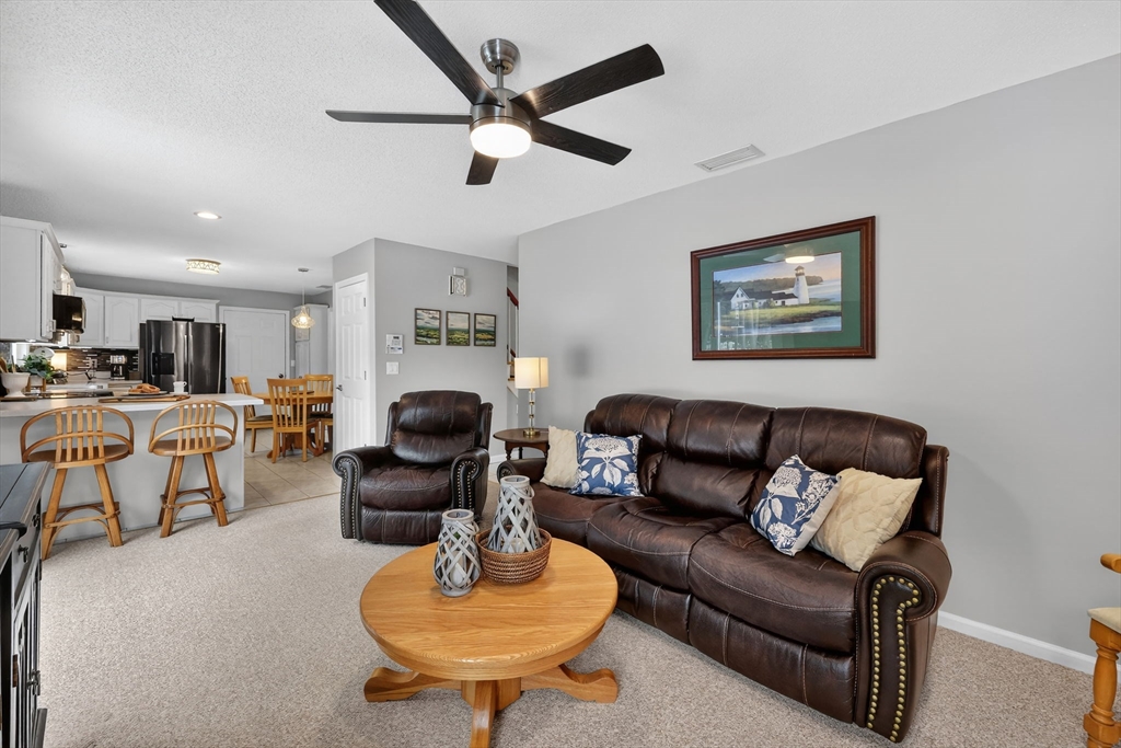 14 Bridle Path Broad Brook, CT 06016 - Photo 6 of 37 a living room with furniture kitchen and a table