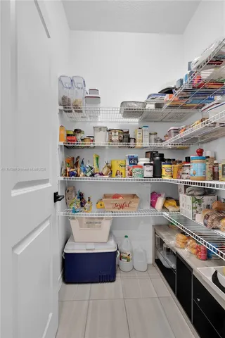 a view of a hallway with white walls
