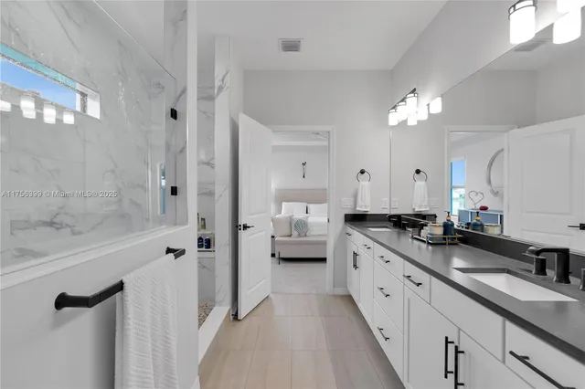 a bed room with a bed and a window