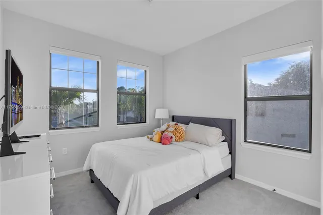 a view of residential houses with swimming pool