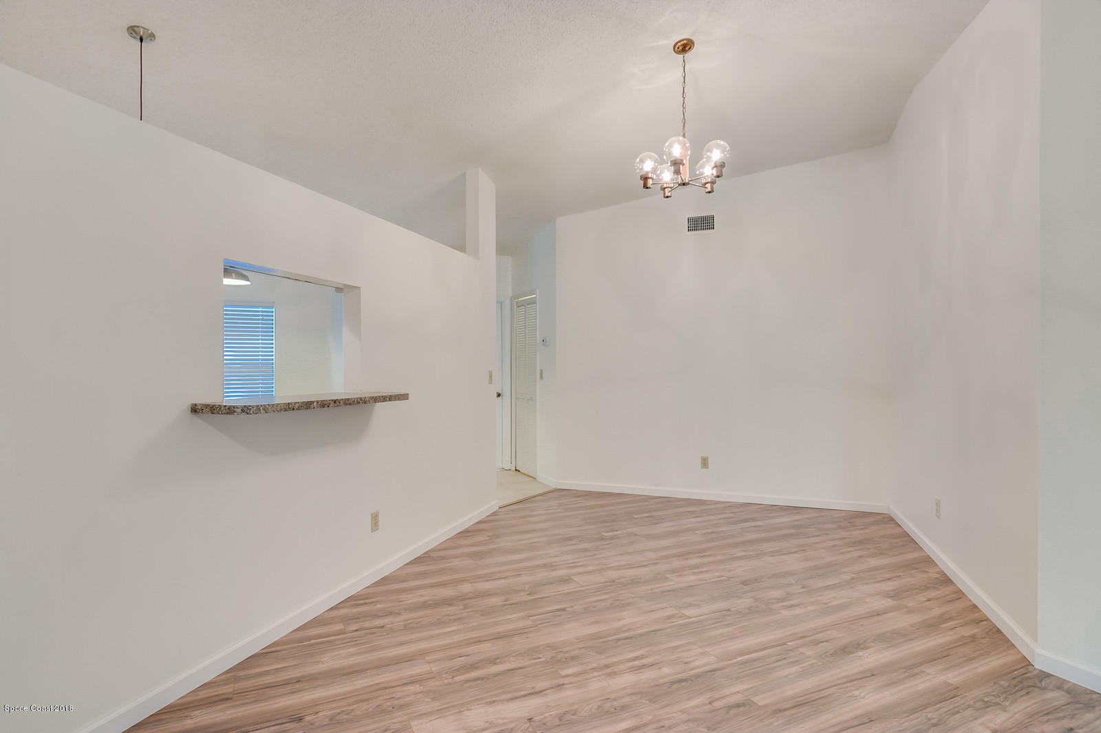 215 Rheine Road Northwest Palm Bay, FL 32907 - Photo 6 of 20 Dining Area w/ Pass-through to Kitchen