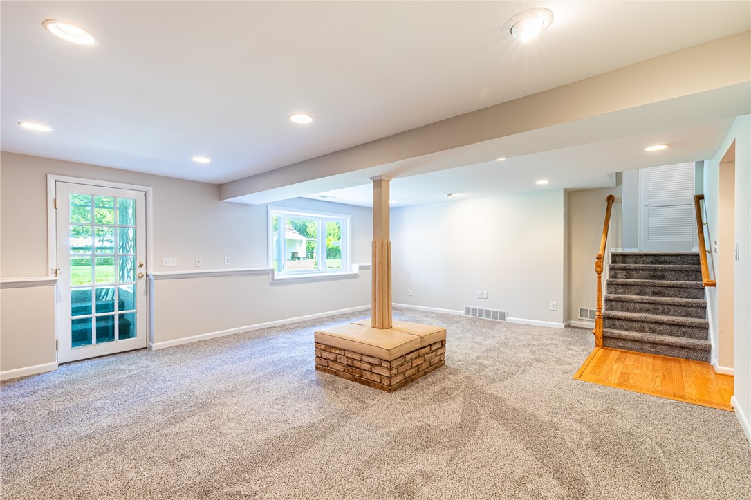 274 Parkview Drive Rochester, NY 14625 - Photo 19 of 41 Family room with convenient walk out and lovely window to the yard.