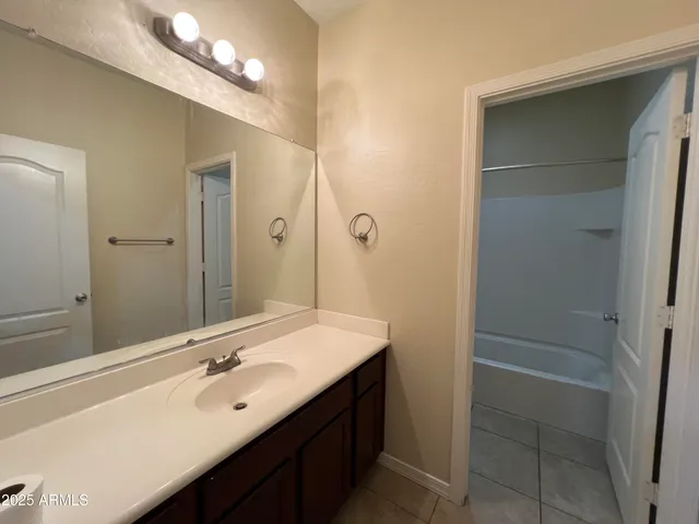 a bathroom with a sink double vanity and a mirror